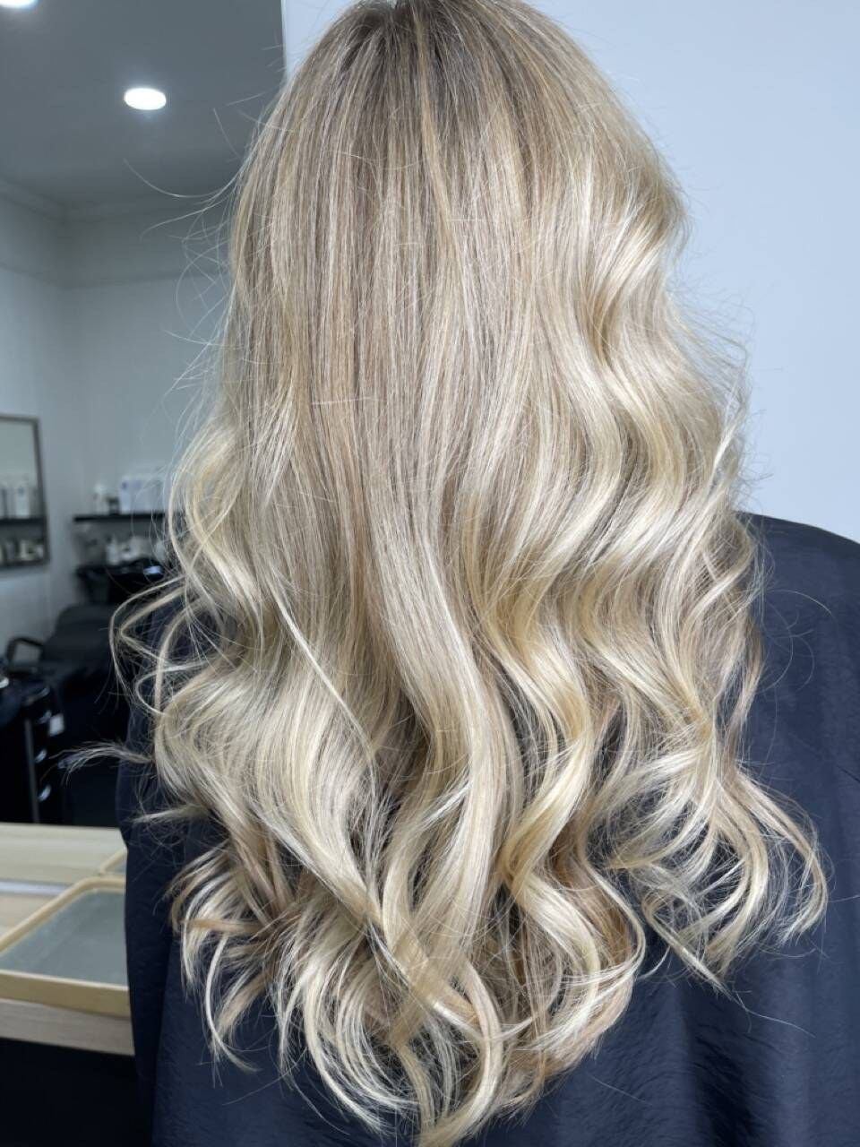 Bright, dimensional blonde in loose waves