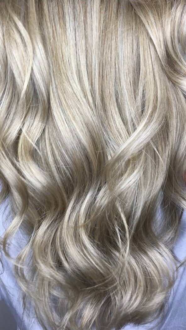 Bright foil blonde with soft face-framing dimension
